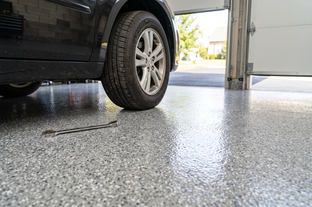 Coated garage floor showing a durable epoxy and polyaspartic finish